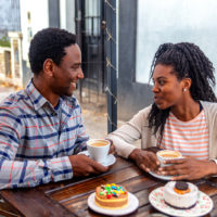 a smiling man and woman talking