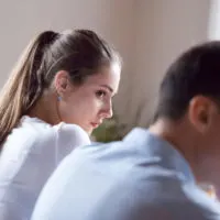 woman looking at man after fight