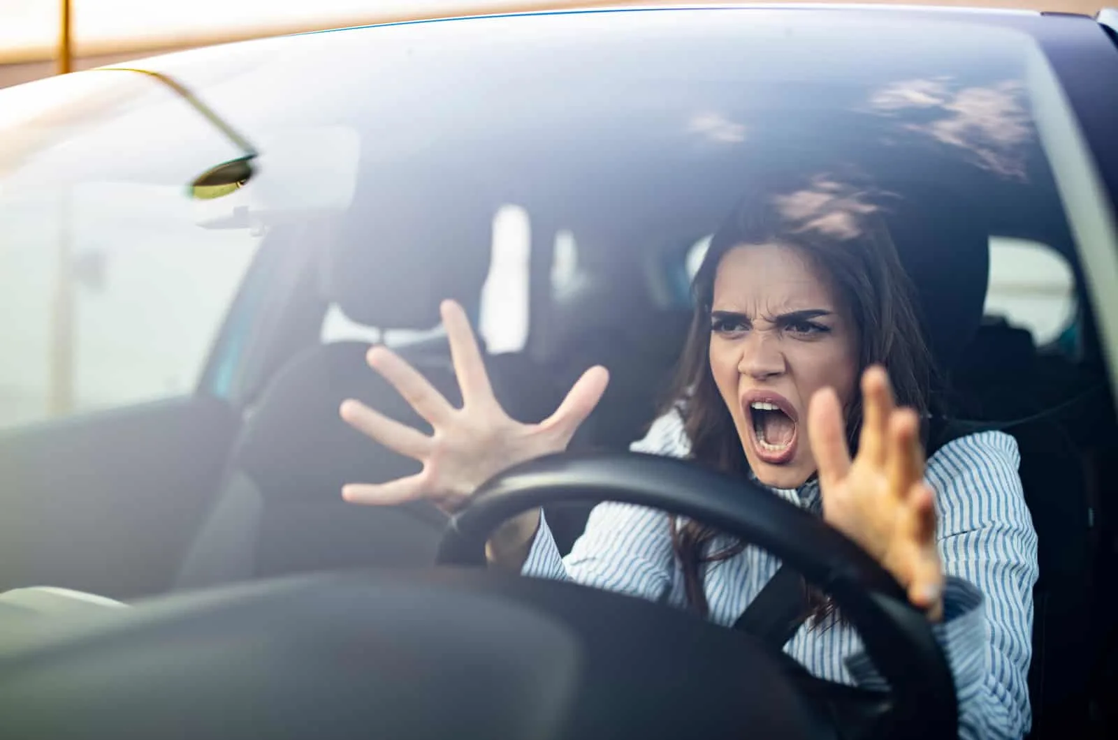 angry woman shouting inside car