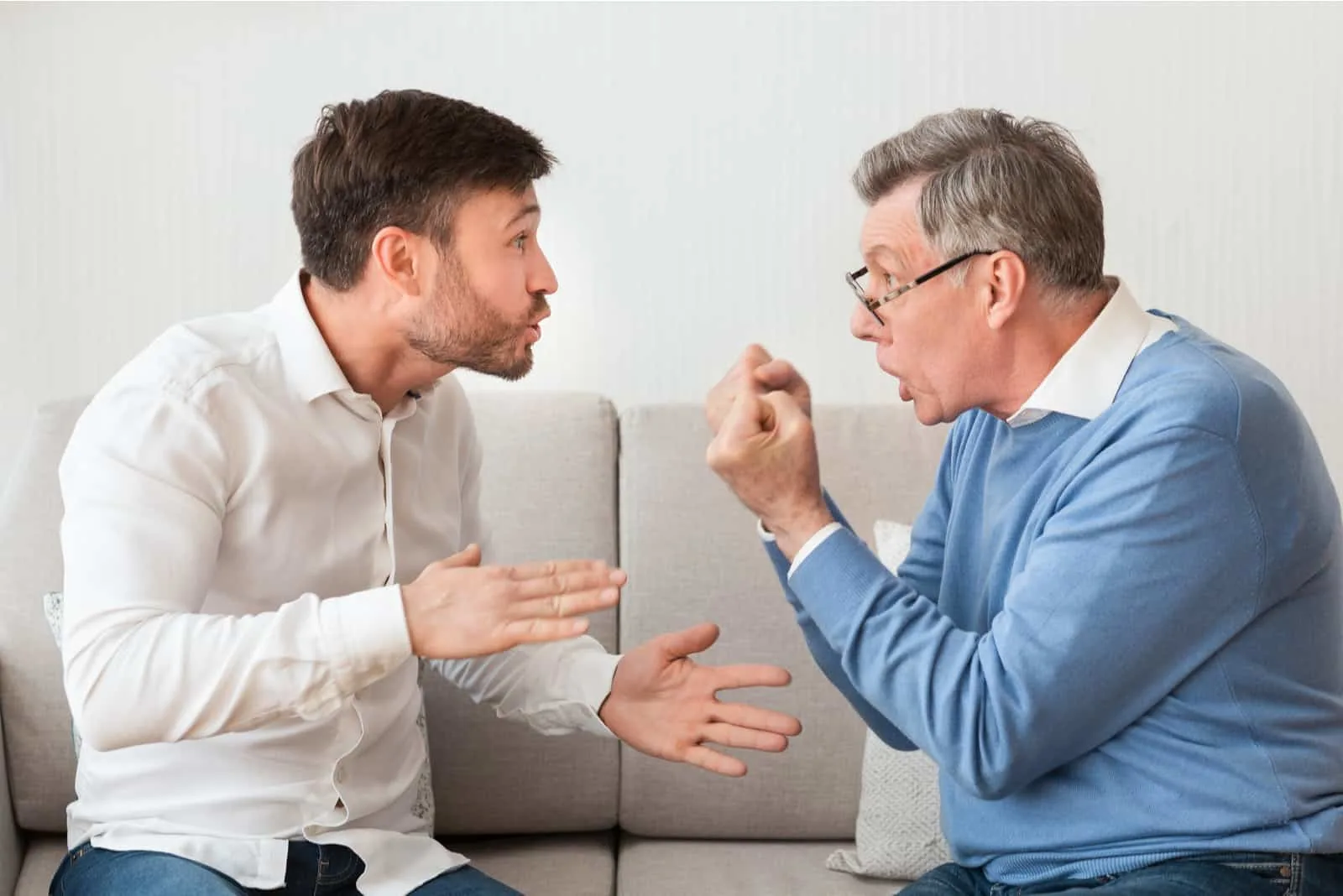 father and son arguing in living room
