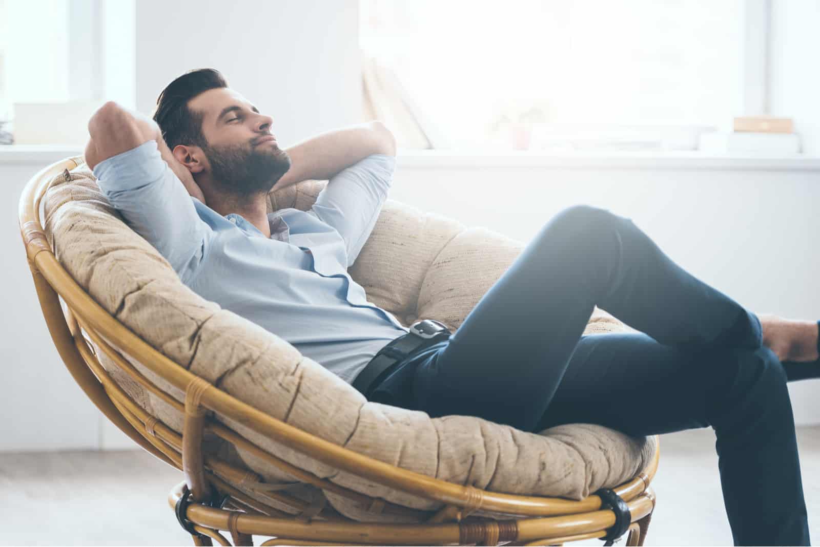 the man sits in a chair and rests