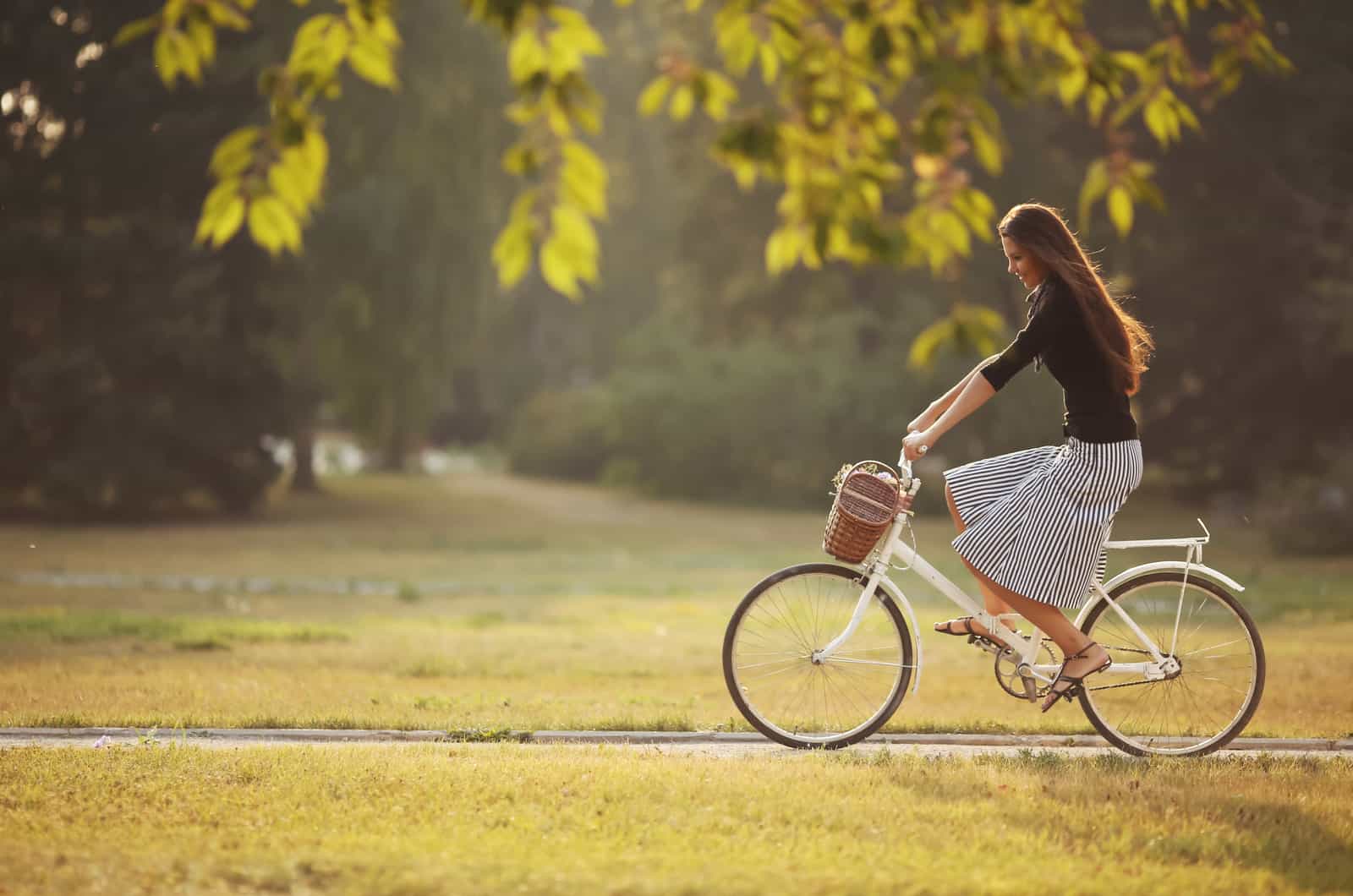 woman riding bike in park
