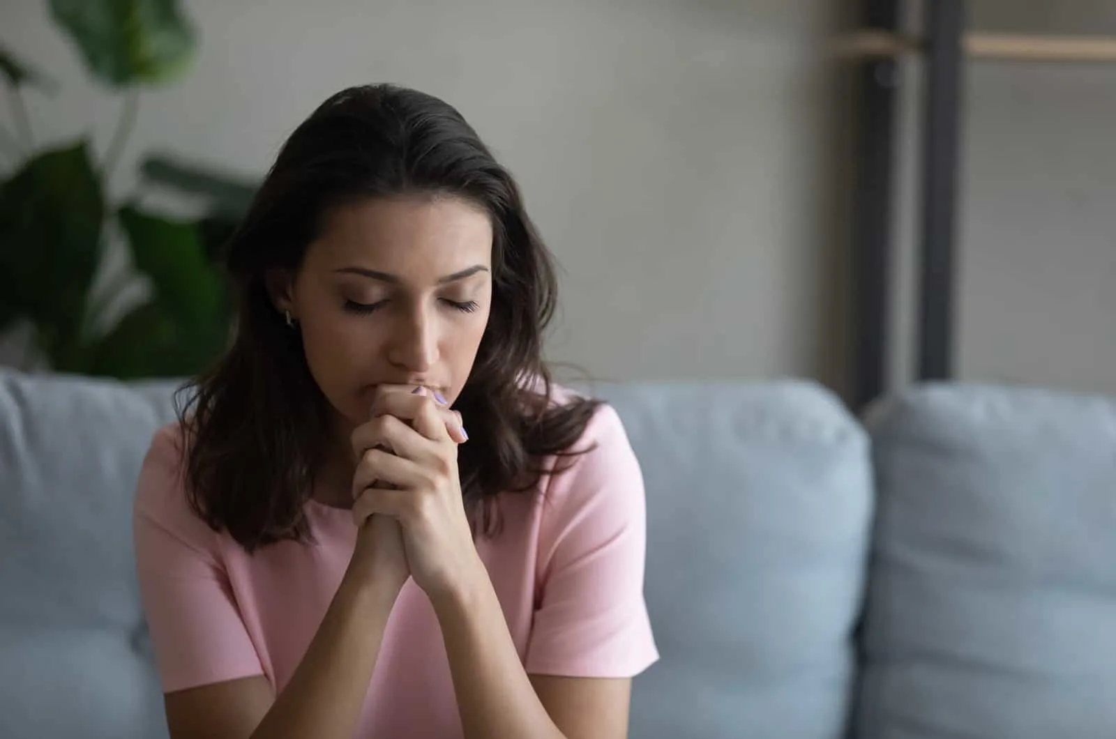 woman sitting with eyes closed