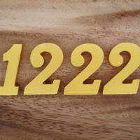 number 1222 on a wooden base