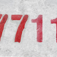 number 7711 on a gray background