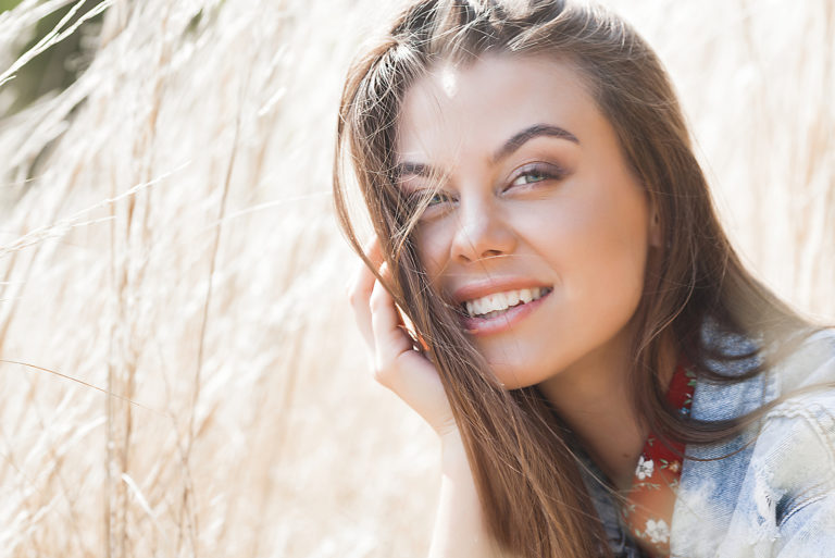 a smiling brown-haired woman