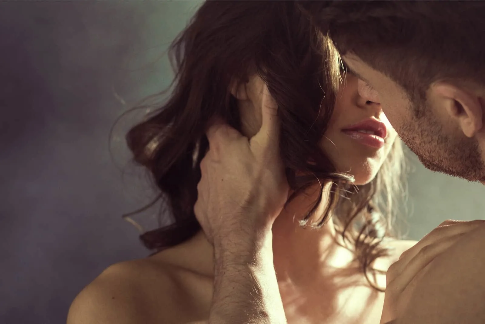a man cuddles with a woman