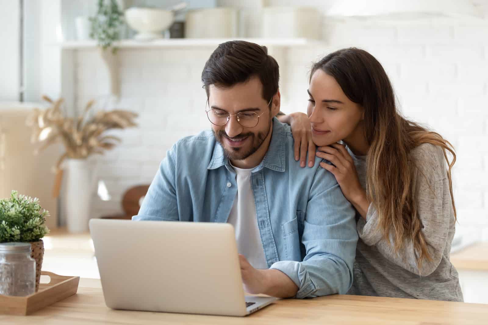 couple on their laptop discussing couple username ideas