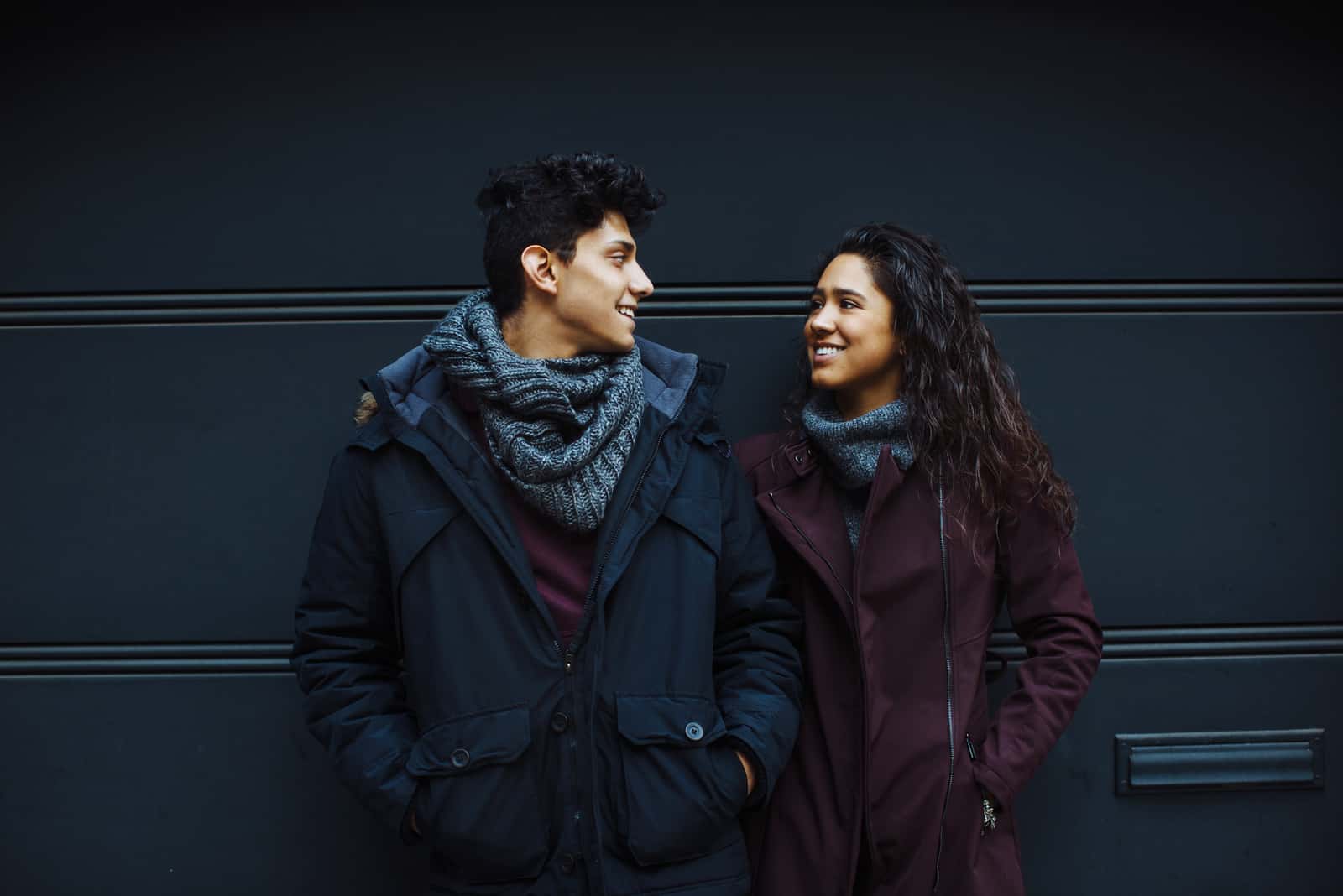 couple standing outside with dark blue background