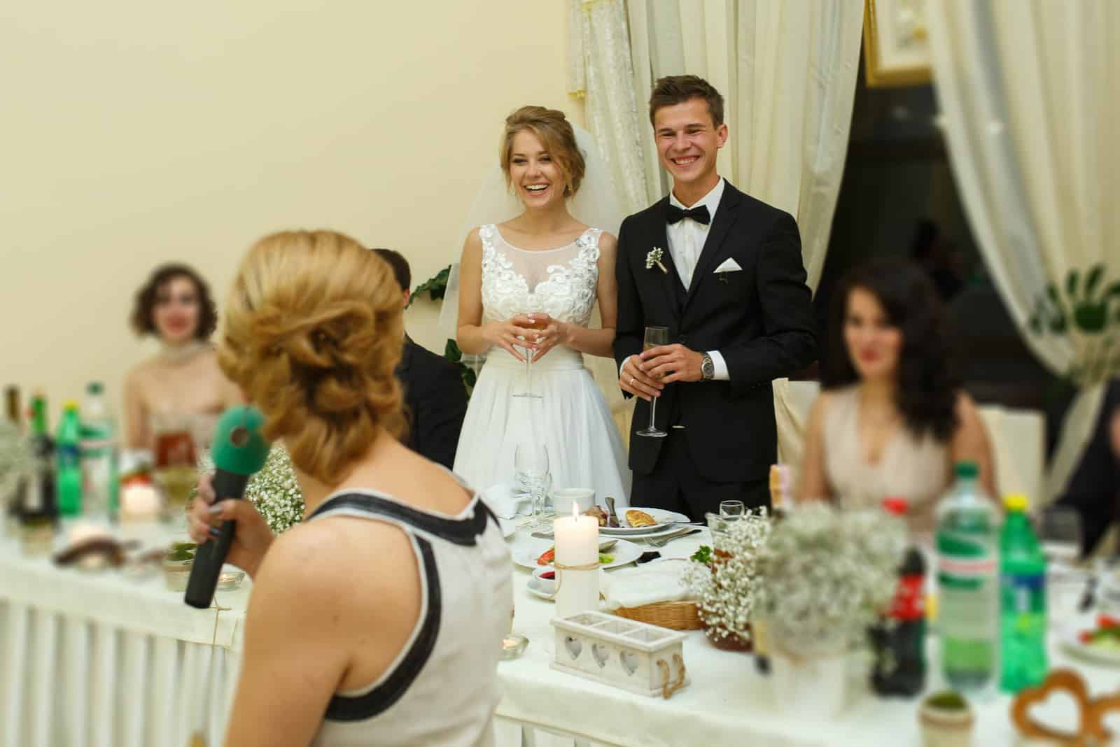 the woman sits in a chair and gives a speech to the newlyweds