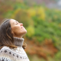 woman breathing in the fresh air
