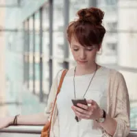 girl looking at her phone