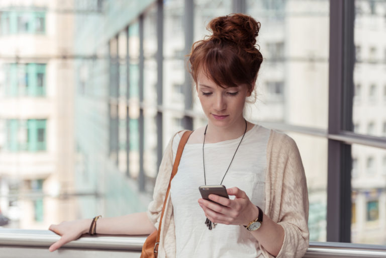 girl looking at her phone