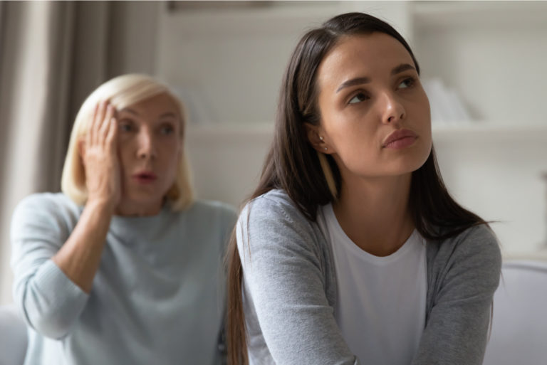 young woman ignoring her toxic mother