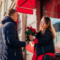 boyfriend giving flowers to his girlfriend