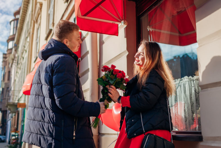 boyfriend giving flowers to his girlfriend