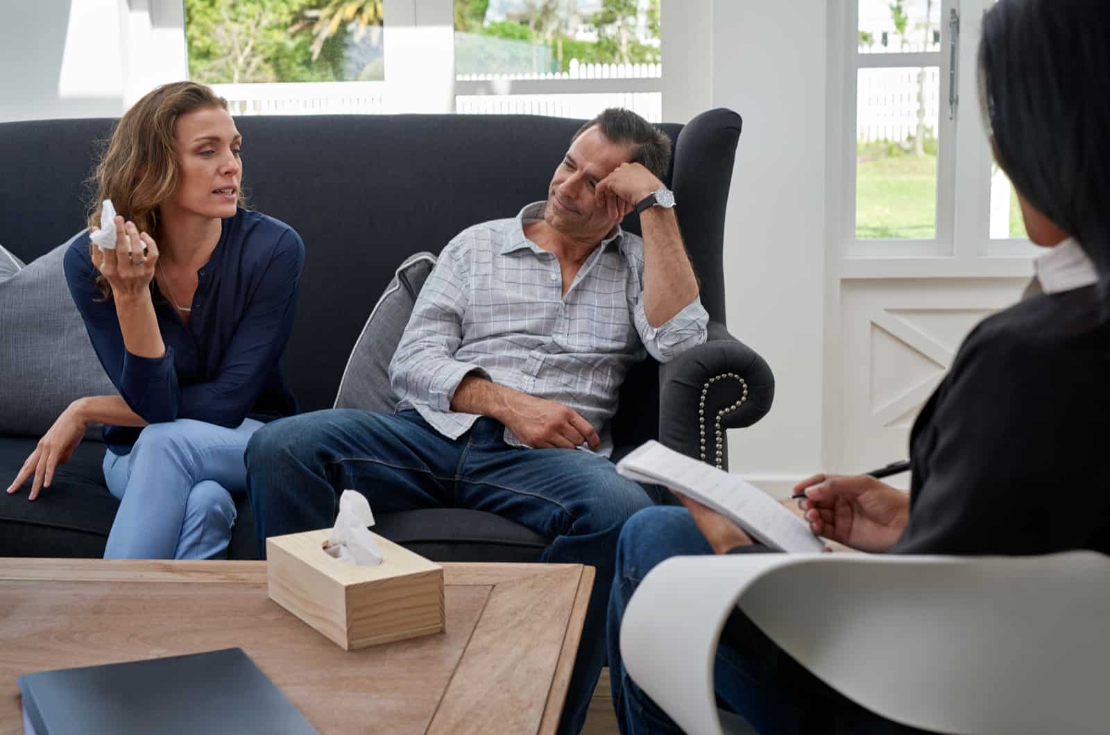 couple sitting on couch at marriage counseling