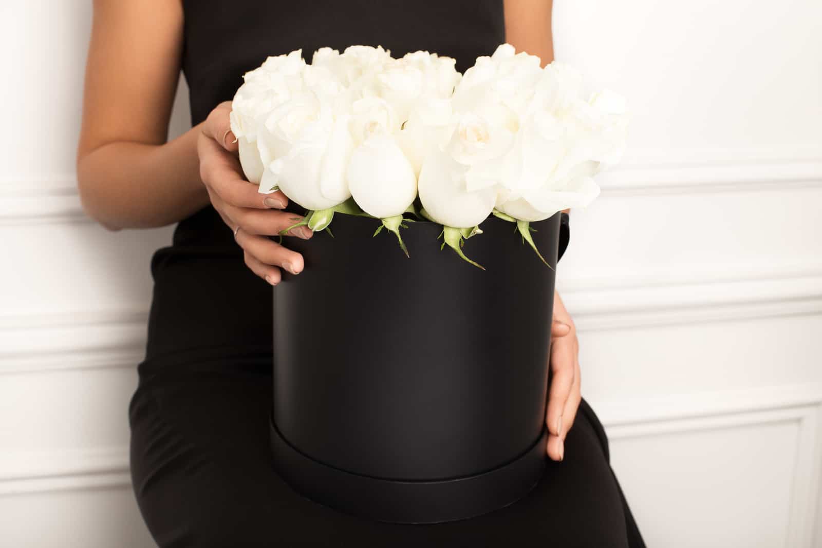 girl holding white rose box