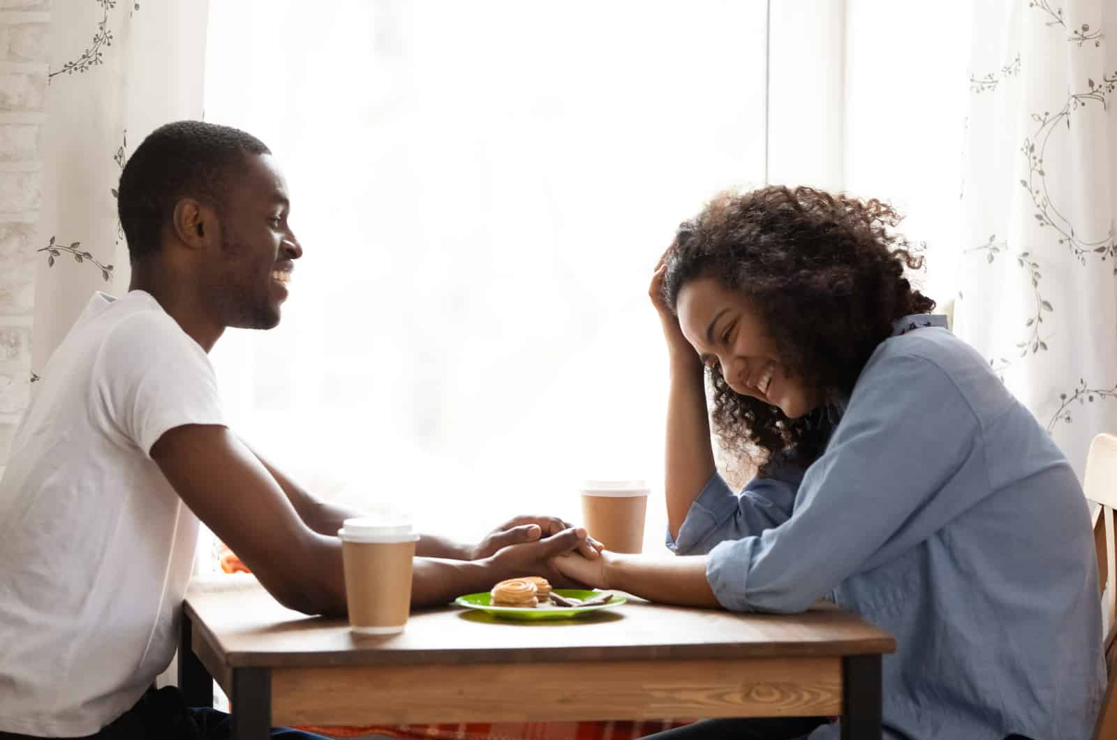 happy couple flirting having breakfast