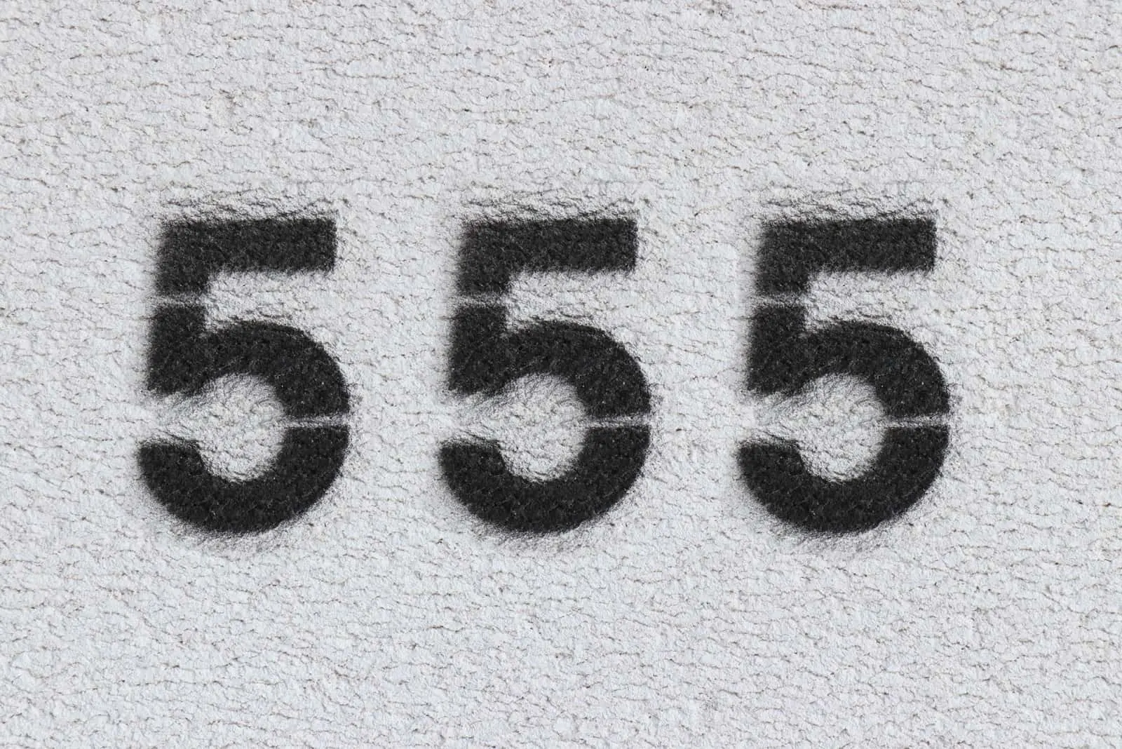 number 555 on grey background
