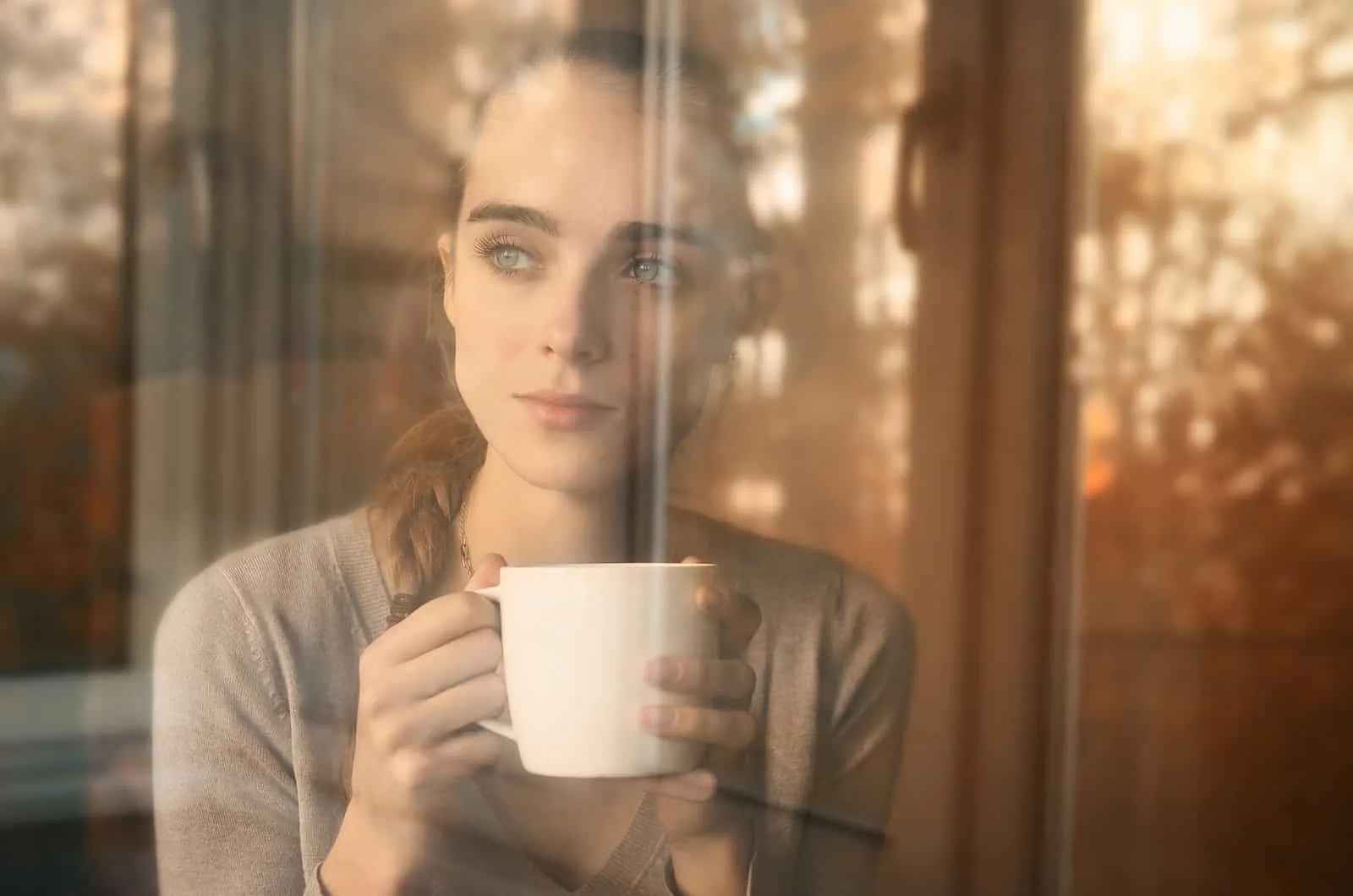 sad woman drinking coffee