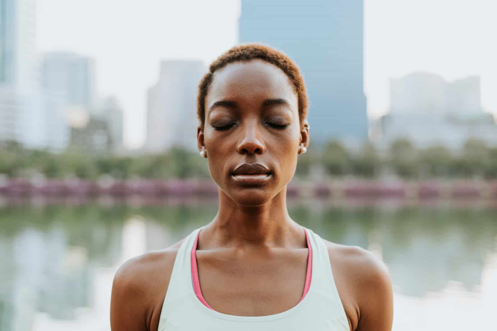 woman meditating at a park