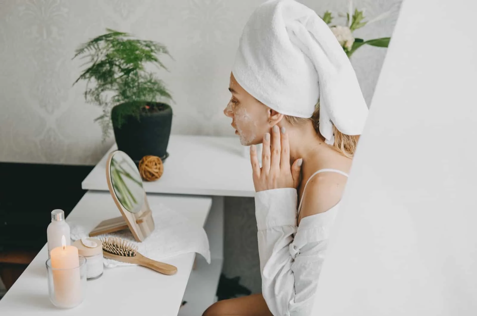 young woman doing her skincare