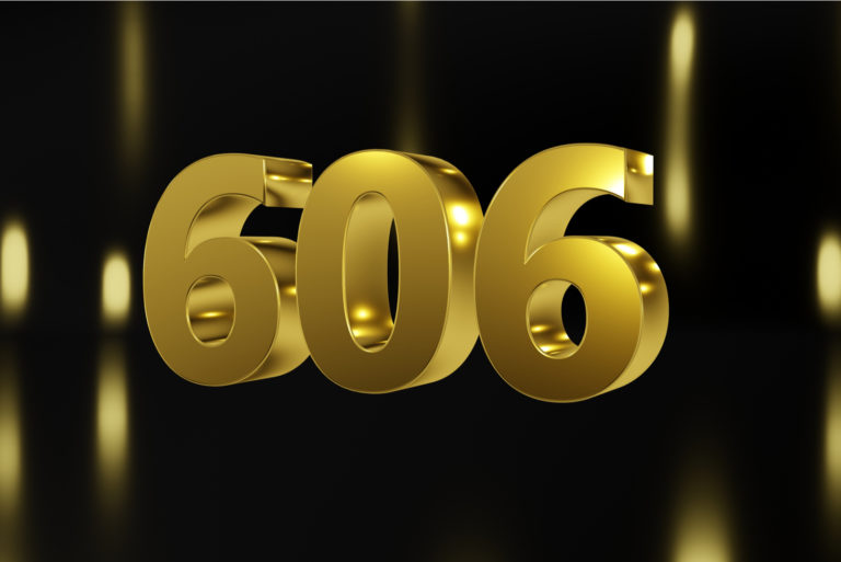 golden number 606 on black background