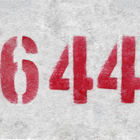 red number 644 on grey wall
