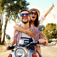 couple riding motorbike through europe