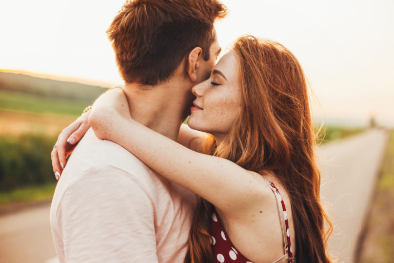 romantic couple hugging outdoor