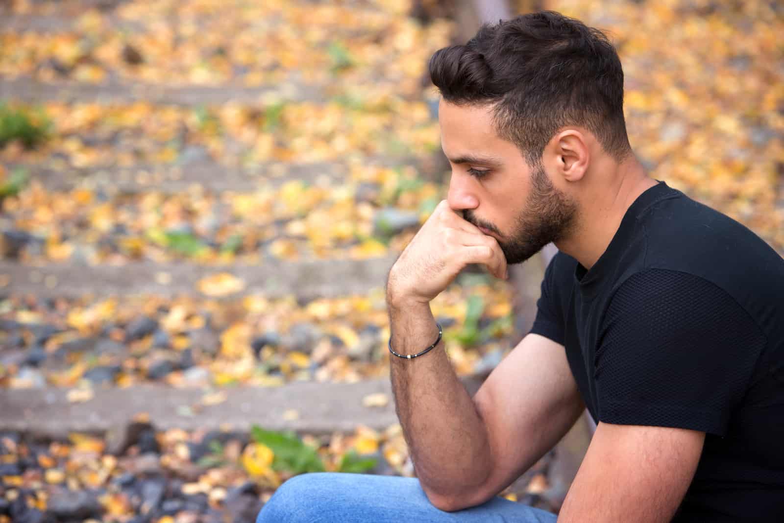 sad man sitting alone and thinking