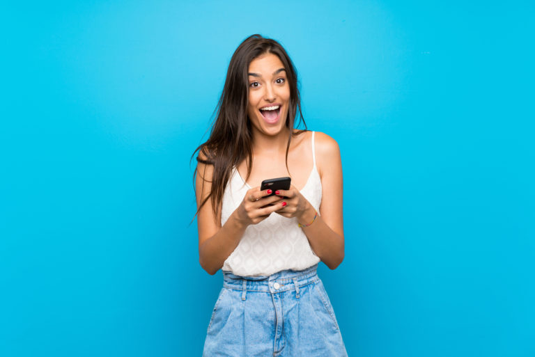 beautiful sassy girl holding a smartphone