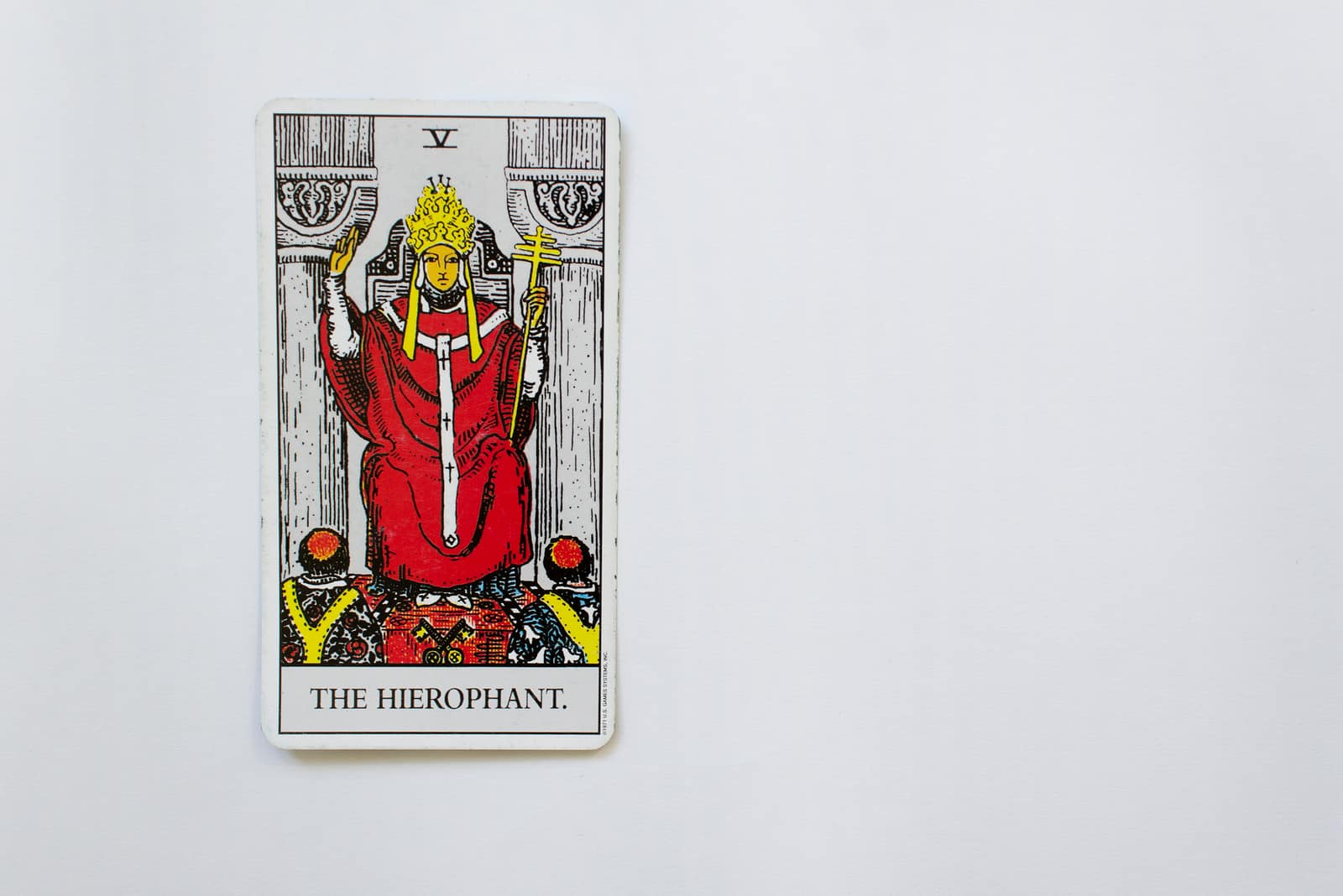 The Hierophant on white table