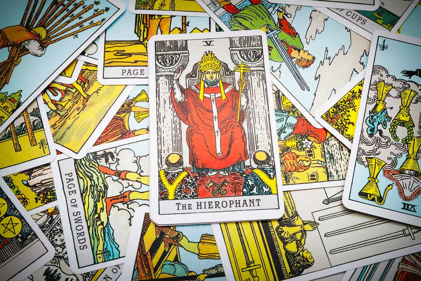 The Hierophant tarot card on top other cards
