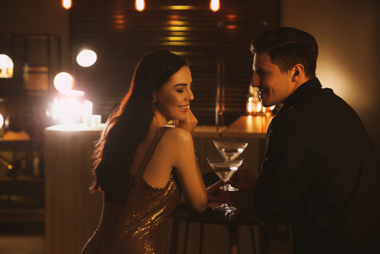 couple flirting in a bar