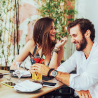 couple laughing in cafe