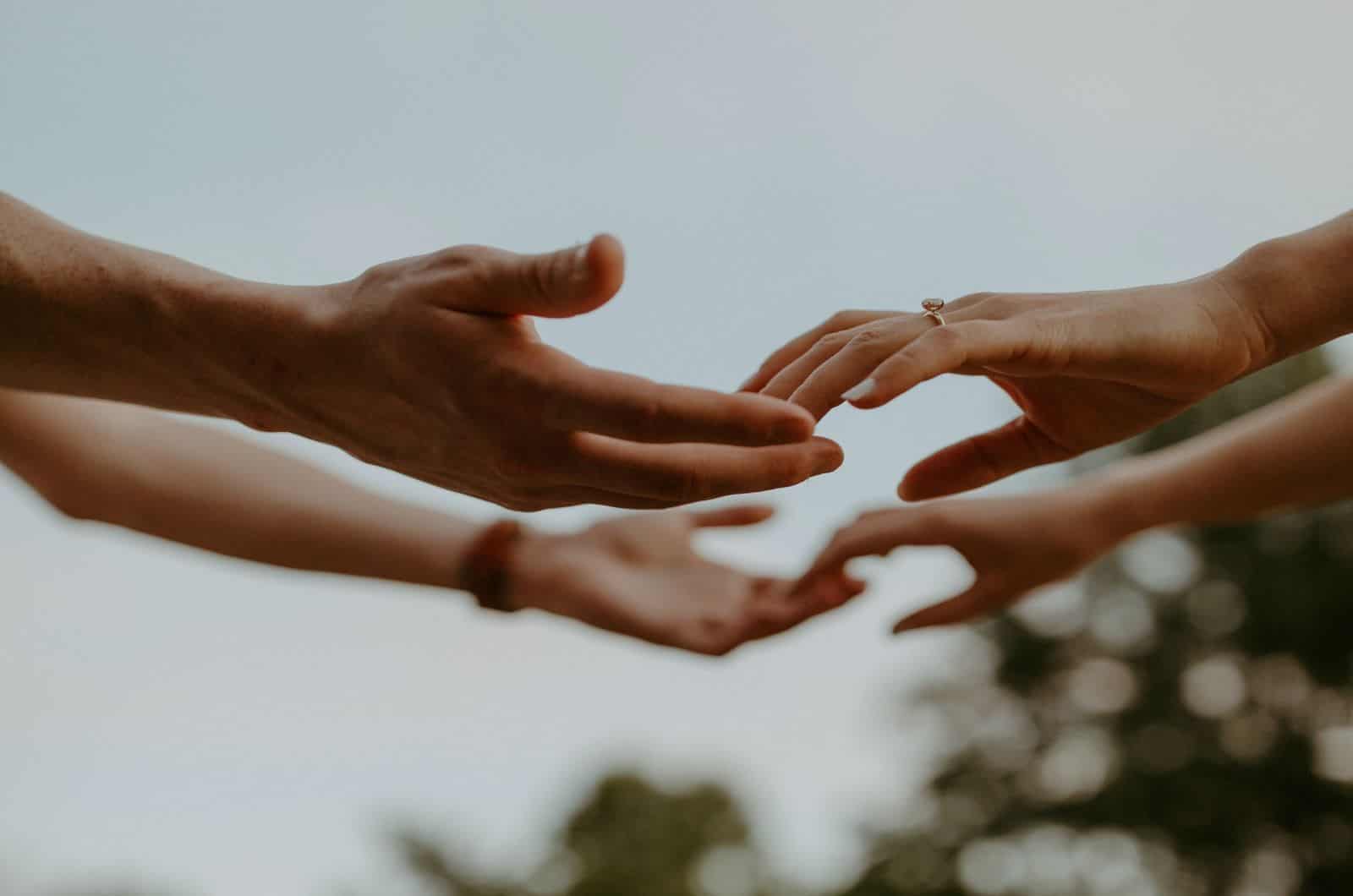 couple touching hands