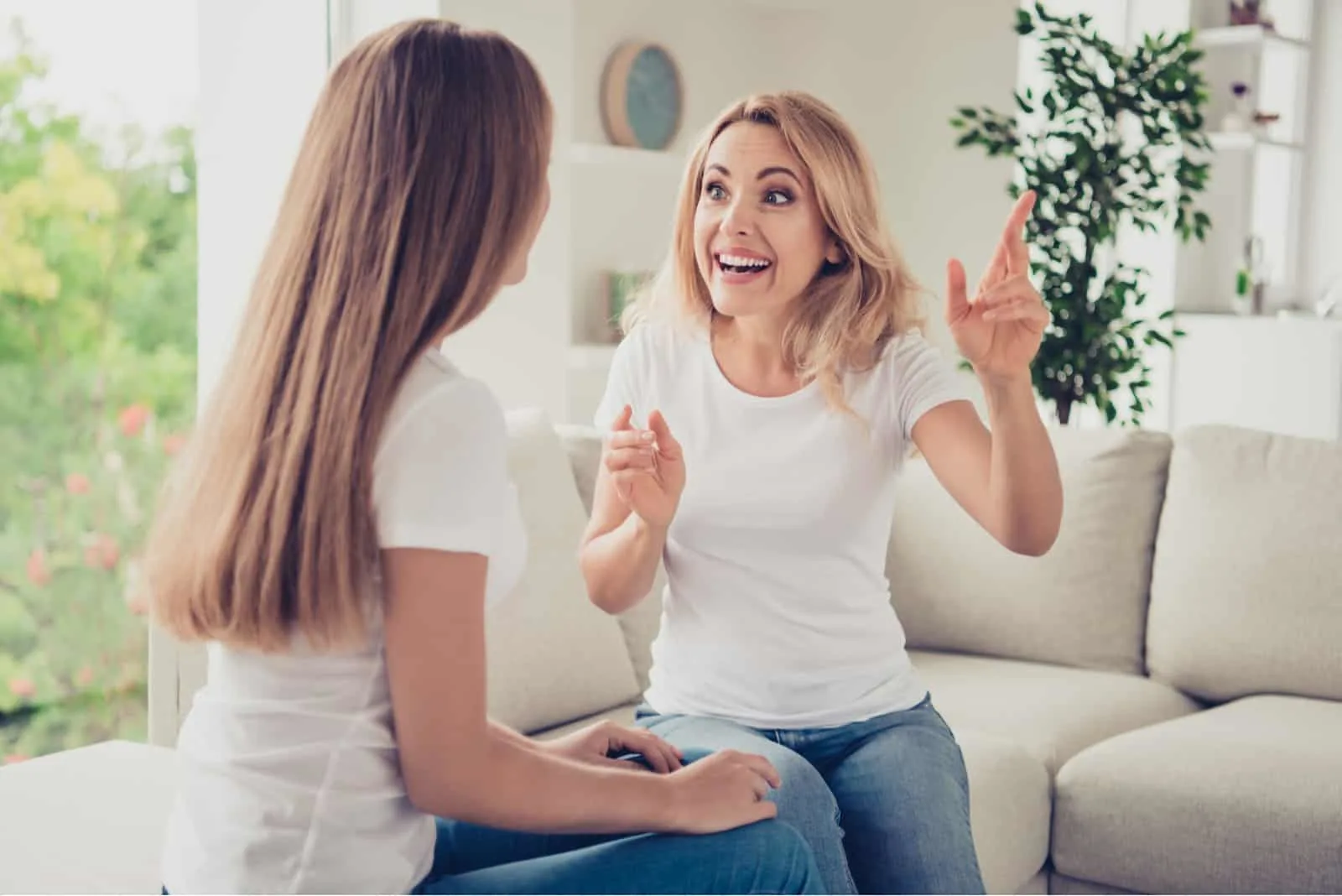 excited woman talking to friend