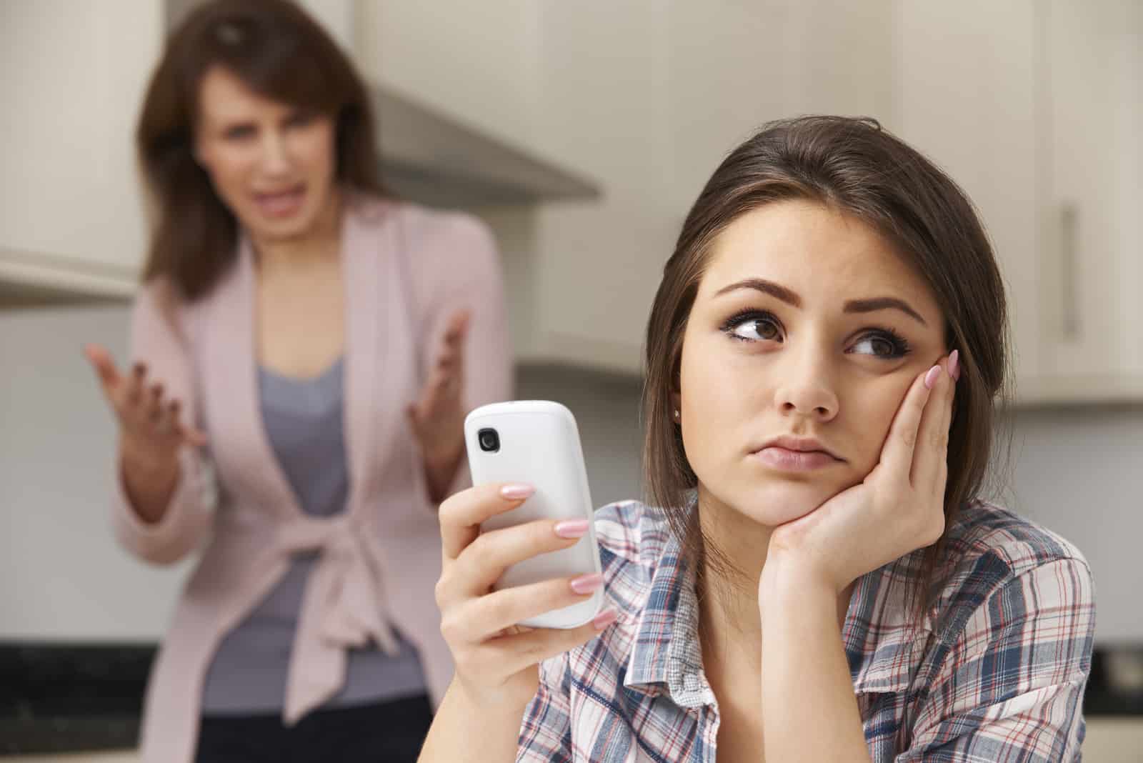 girl trying to ignore toxic mother