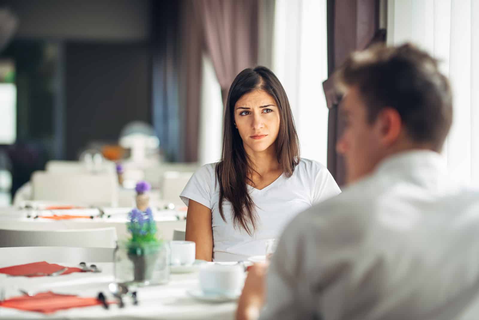 man looking away while on date