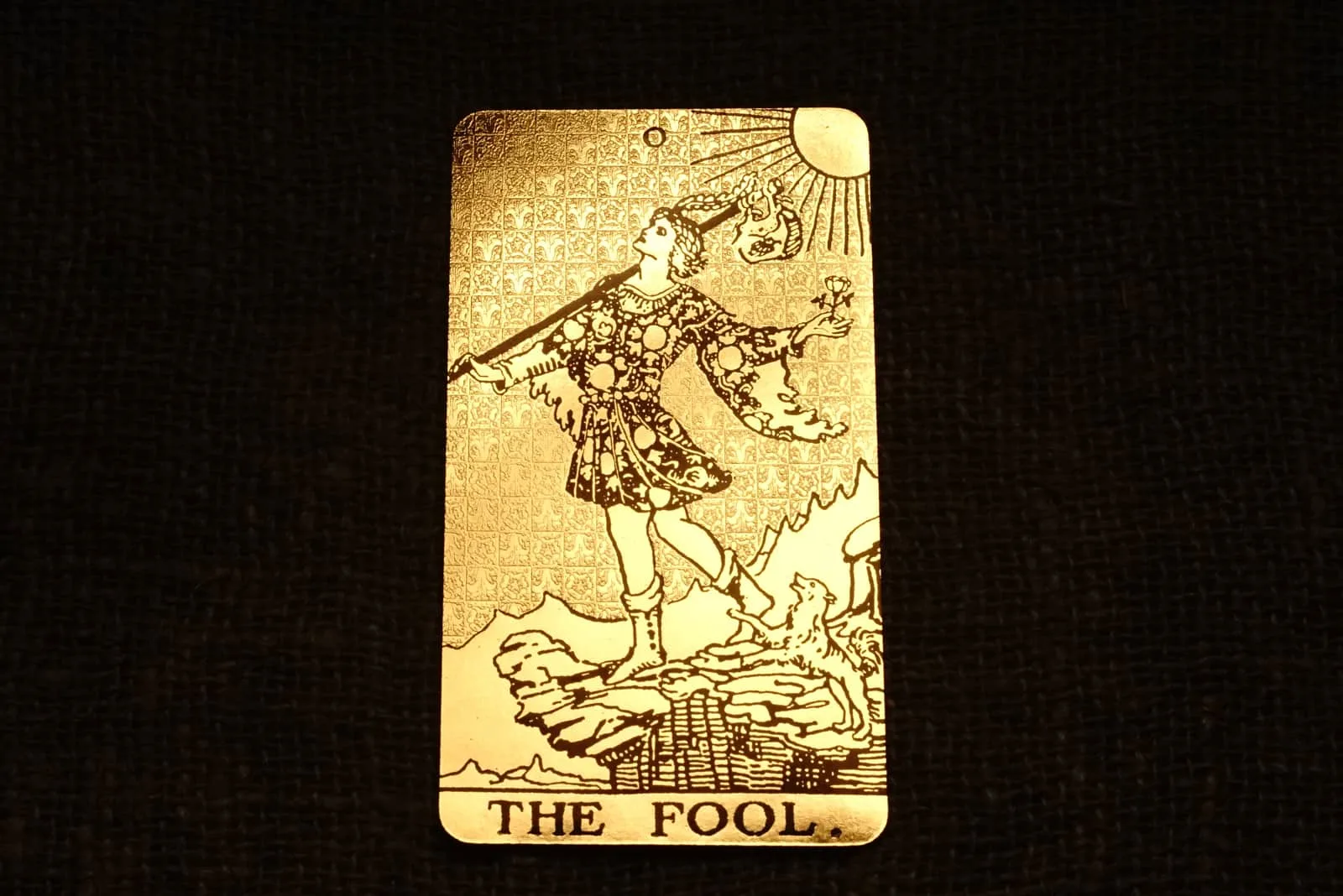 the fool tarot card on the black background