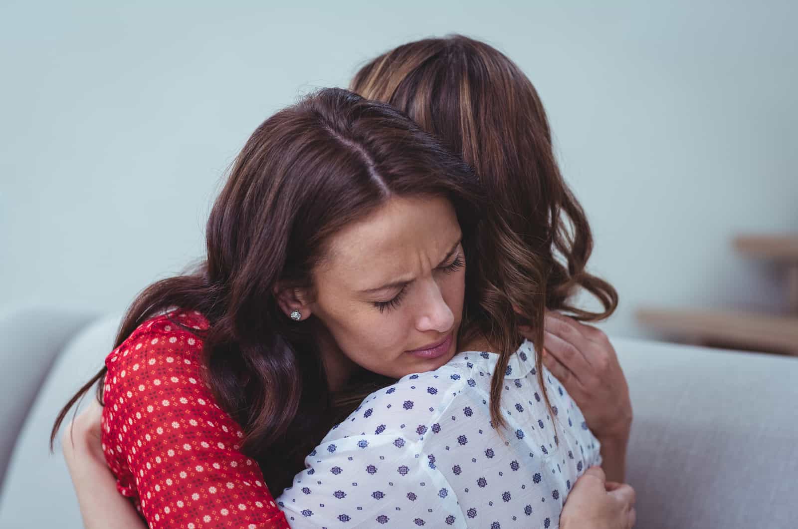 two female friends hugging