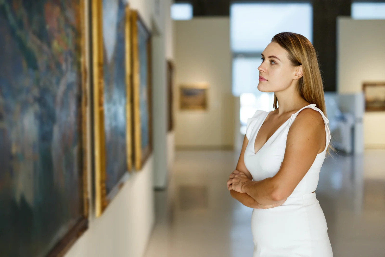woman looking at art in museum