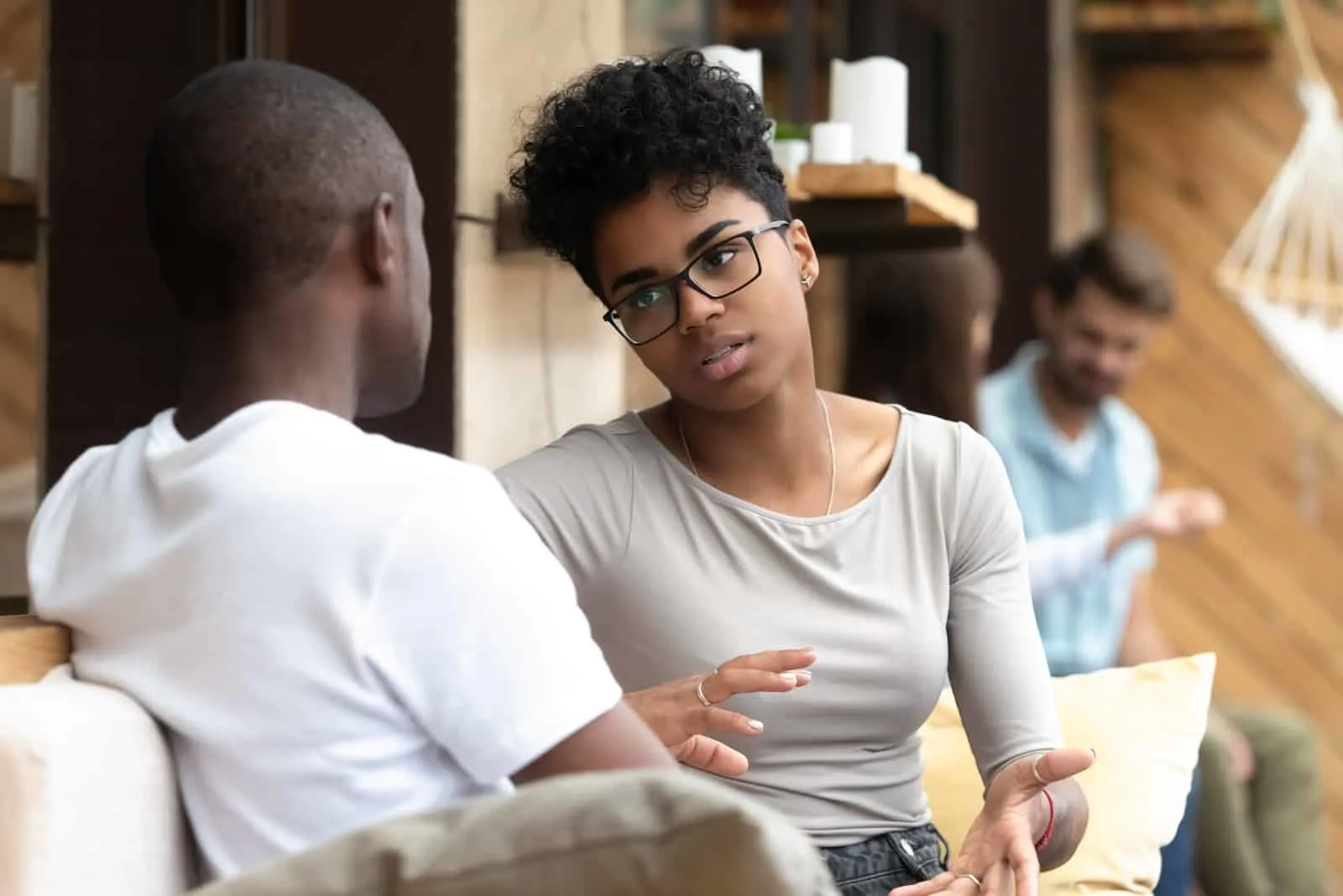 woman talking to man about 7 signs of stupidity