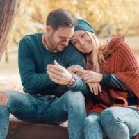 couple sitting in the park and hugging