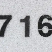 number 716 on grey wall