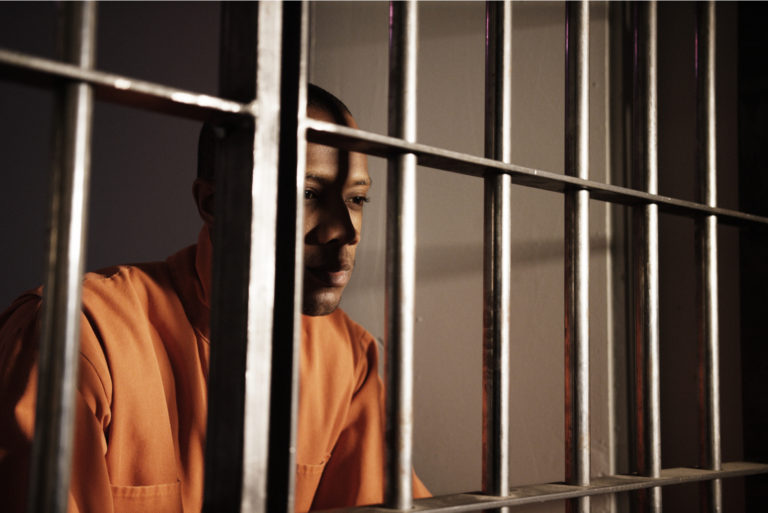 the prisoner is sitting in jail