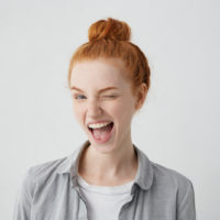 young redhead winking