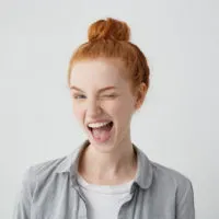 young redhead winking